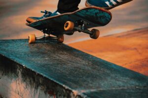 Skateboarder riding through an urban skatepark during a community session