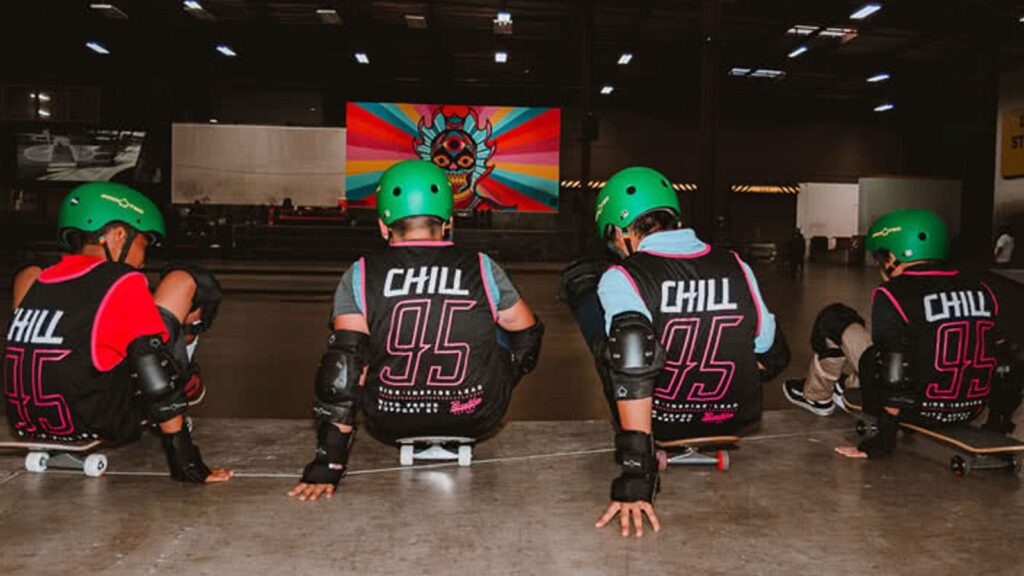 Young people sitting on skateboards during a Chill Foundation youth program