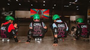 Young people sitting on skateboards during a Chill Foundation youth program