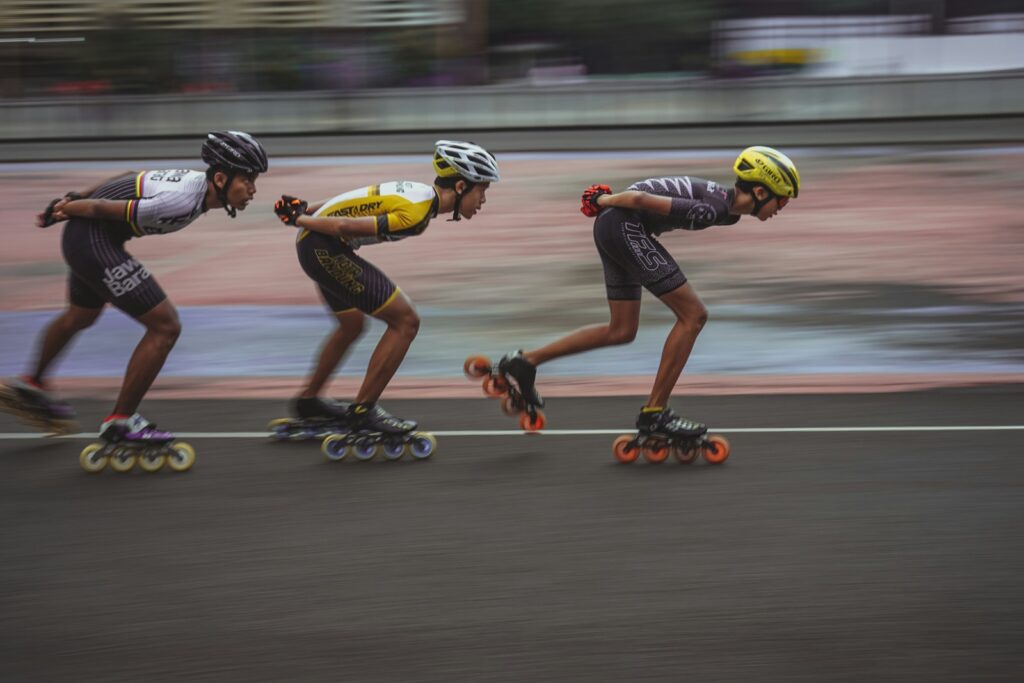 Inline speed skaters racing on an outdoor track