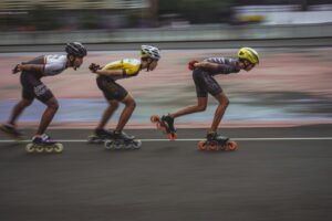 Inline speed skaters racing on an outdoor track