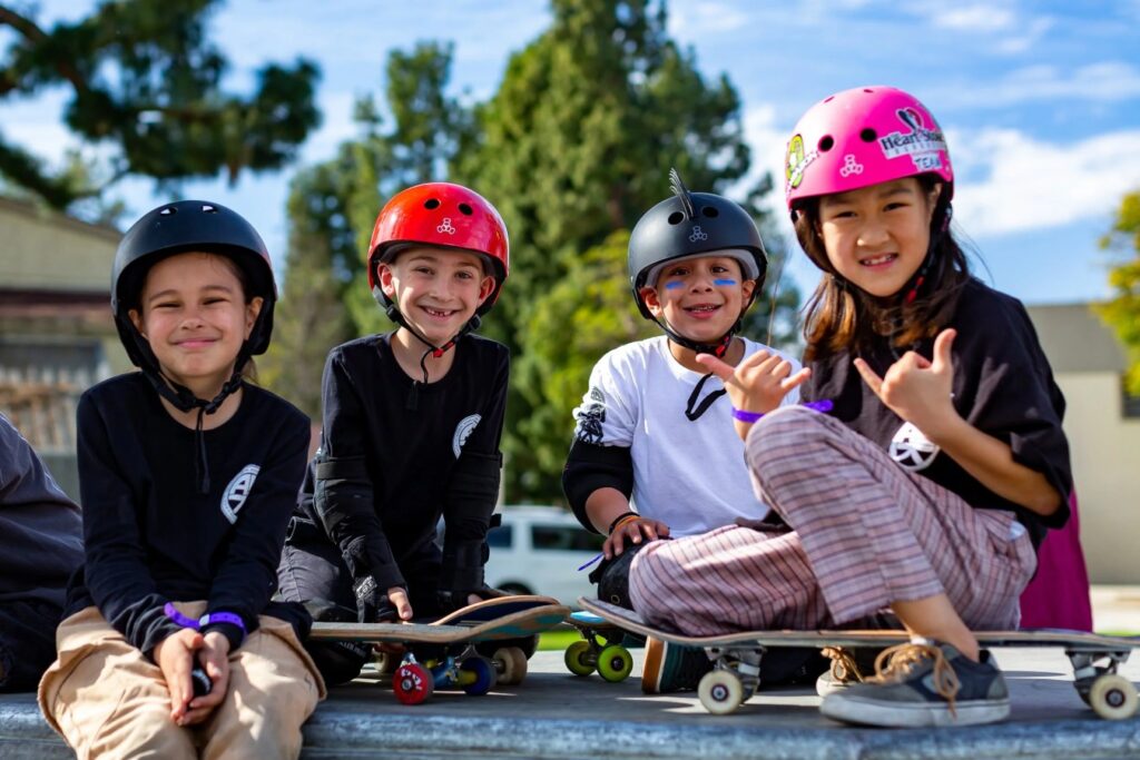 Young skateboarders at a community skatepark supported by The Skatepark Project
