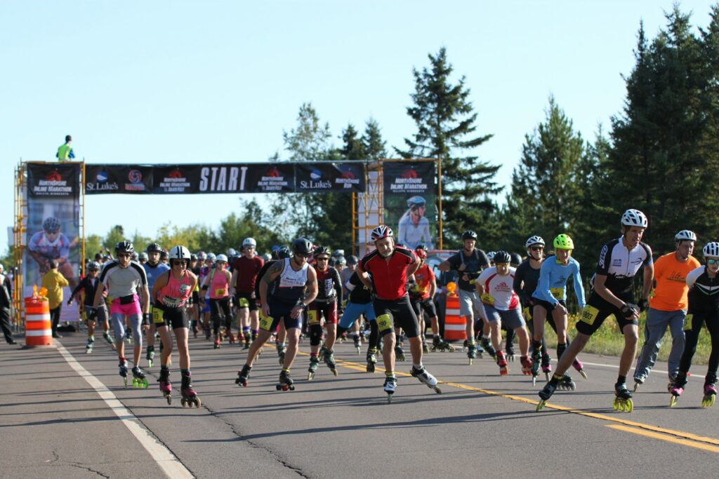 Inline skaters racing through a marked city course