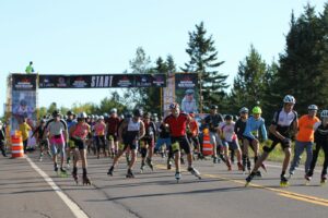 Inline skaters racing through a marked city course